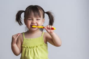 get child to brush their teeth