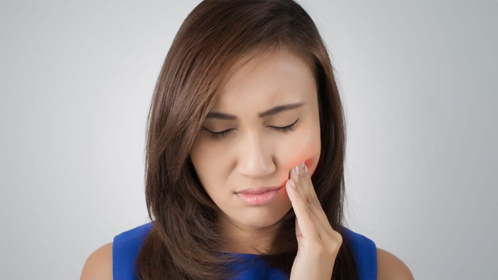 woman with tooth pain min