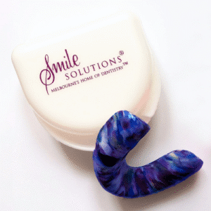Colourful dual laminate sports mouthguard with storage case